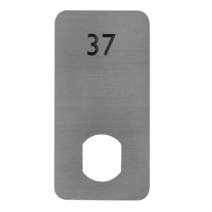 An aluminium locker number plate with a black number 37 on top and a double d cut out at the bottom for locker doors.