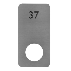An aluminium locker number plate with a black number 37 on top and a circular cut out at the bottom for locker doors.