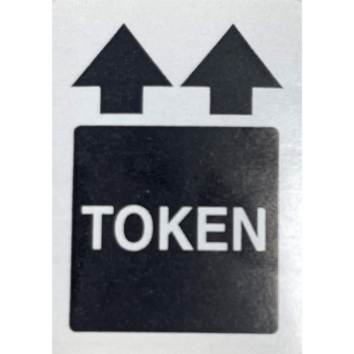 A black and white coin lock token sticker with arrows pointing to the top on a white background.